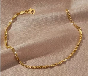 Bracelet acier inoxydable plaqué or 18k doré torsadé - Foto 1 di 2
