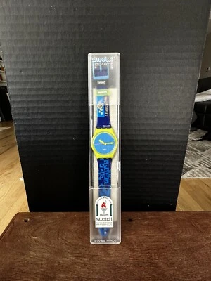 RELOJ MUESTRA ATLANTA 1996 OLÍMPICOS AZUL Y VERDE NUEVO Y PRECINTADO Foto 1 de 4