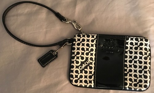 Borsa da polso Coach nera bianca firmata rivestita tela bordo pelle piccola