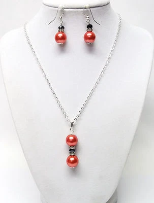 Colgante de perlas de vidrio naranja con juego de collar/pendientes de diamantes de imitación  Foto 1 de 4