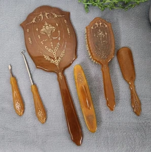 Antiguo juego de aseo de baquelita cepillo espejo gancho cerdas naturales ámbar 6 piezas - Imagen 1 de 9
