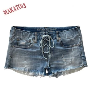 Pantaloncini corti elasticizzati American Eagle donna taglia 6 vita bassa invecchiati stringati - Foto 1 di 9
