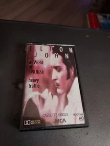 ELTON JOHN CASSETTE SINGLE A WORD IN SPANISH/HEAVY TRAFFIC - Picture 1 of 2