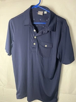 Polo de golf Puma para hombre mediano azul marino con bolsillo  Foto 1 de 3