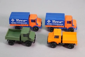 DF027 ROCO train Ho 1/87 2 camions bachés + 2 camions plateau Unimog 1300 - Imagen 1 de 3