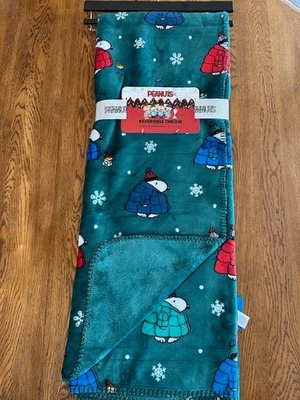 Snoopy Peanuts Winter Puffer Jacket Snowflakes Reversible Blanket 50 x 70"Green - Image 1 of 4