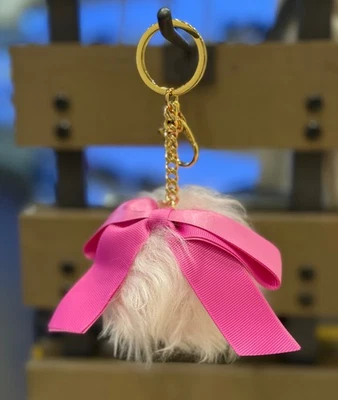 Llavero con arco regalo navideño rosa UGG Foto 1 de 4