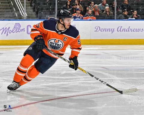 Connor McDavid Edmonton Oilers Unsigned Orange Jersey Skating Photograph Cover