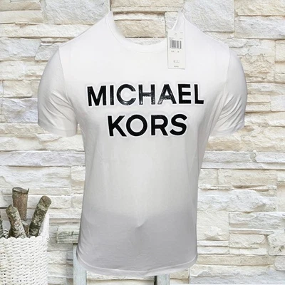 CAMISETA HOMBRE NUEVA CON ETIQUETAS MICHAEL KORS PRECIO DE VENTA SUGERIDO POR EL FABRICANTE $56.99 BLANCA CUELLO REDONDO MANGA CORTA TALLA L Foto 1 de 4
