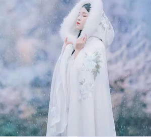 white faux fur cloak