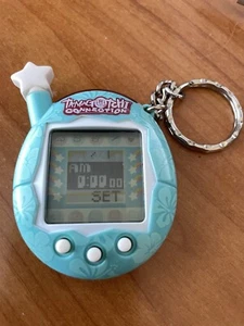 Portachiavi giocattolo antenna stella fiore hawaiano blu Tamagotchi Connection 2004 funzionante - Foto 1 di 9