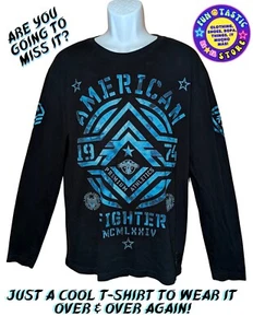 CAMISA UNISEX. NEGRO AZUL GRÁFICOS "MERICAN FIGHTER TRAINING MISSION" MANGA LARGA - Imagen 1 de 13