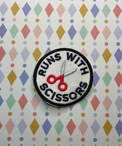 Embroidered iron on merit patch: Runs with scissors. - Picture 1 of 2