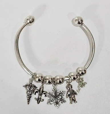 SilverTone Open Bangle Charm Bracelet Caduceus Fleur-de-Lis Snowflake Child Frog - Image 1 of 4