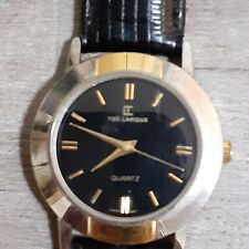 Ted Lapidus Ladies Wrist Watch TL-MTSRB-7106T gold tone black leather band 