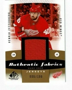 2010-11 SP GAME USED HENRIK ZETTERBERG AUTHENTIC FABRICS JERSEY GOLD #ed 06/100 - Bild 1 von 2