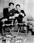 Dean Martin & Jerry Lewis in studio chairs looking at star photos 24x36 poster