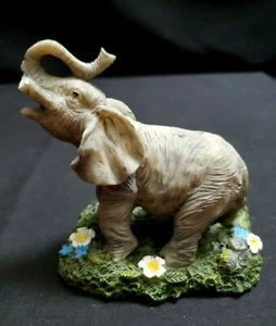 Resin  Elephant  Figurine  in  Grass  with  Flowers  3-1/2" Tall - Picture 1 of 11