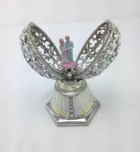 Music box smaltato su metallo gioiello a forma di uovo - Foto 1 di 7