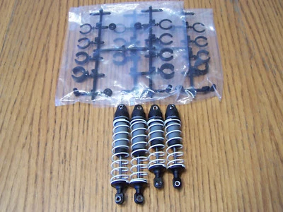 Amortiguadores traseros delanteros Traxxas 2x2 RUSTLER BL-2s con resortes y espaciadores de amortiguador / VXL Foto 1 de 3