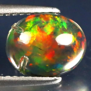 1.59 ct Superb Oval Cabochon (10 x 8 mm) Ethiopian Flashing Black Opal - Picture 1 of 2