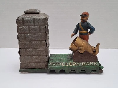 Vintage mechanical cast iron Artillery  Coin  Bank  Book of knowledge - Image 1 of 4