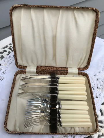 SIX SILVER-PLATE FISH KNIVES AND FORKS IN BROWN LEATHER COVERED BOX Cover