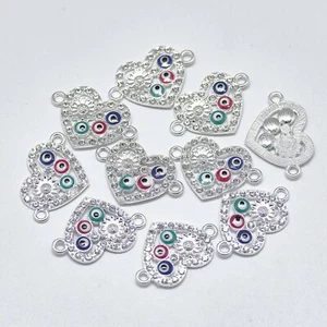 Eslabones de corazón esmaltados y diamantes de imitación de mal de ojo con estrás de cristal y flor. 10 piezas - Imagen 1 de 2