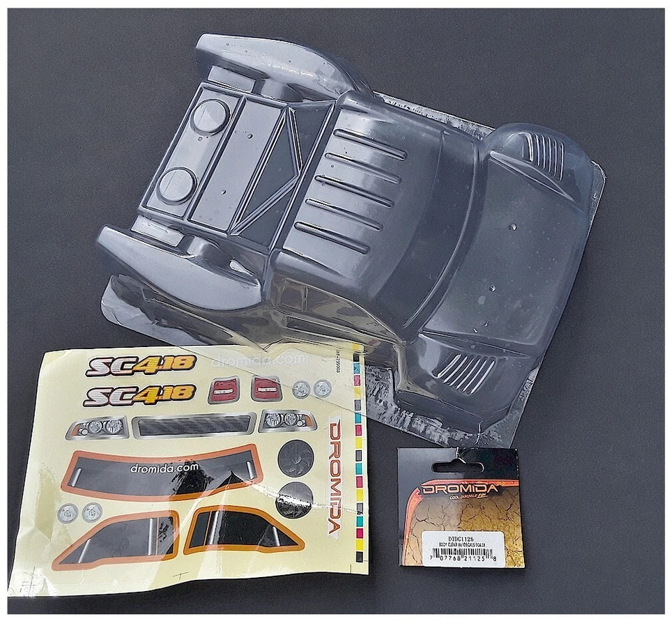 Корпус радиоуправляемого автомобиля Dromida DIDC1125 прозрачный с наклейками SC 4.18 снят с производства из старых запасов новый в коробке - Изображение 1 из 2
