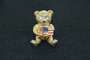 Vintage Napier Gold Tone Articulated Teddy Bear Brooch Pin with Flag Rhinestones - Picture 1 of 6
