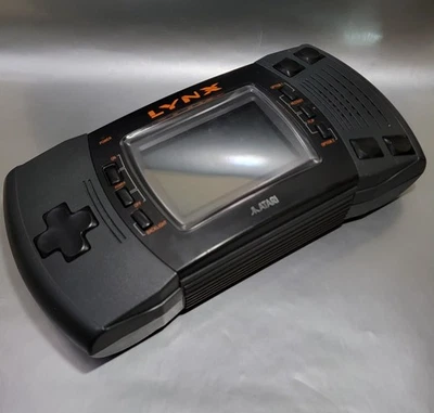 Sistema de consola Atari Lynx II 2 para piezas o reparación sin cubierta de batería  Foto 1 de 2