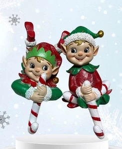 SET OF 2 RESIN ELF AND CANDY CANE STOCKING HOLDERS 1 HAS BEEN REPAIRED SEE PIC - Picture 1 of 5