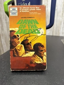 Dawn Of The Dead VHS mit Tom Savini Autogramm - Bild 1 von 2