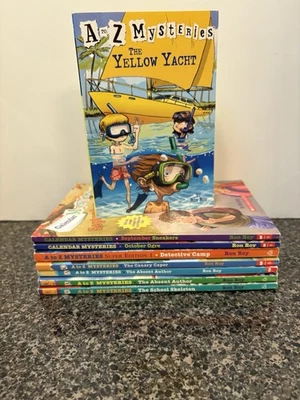 A to Z / Calendar Mysteries Paperback Books, Lot Of 8 - Image 1 of 4