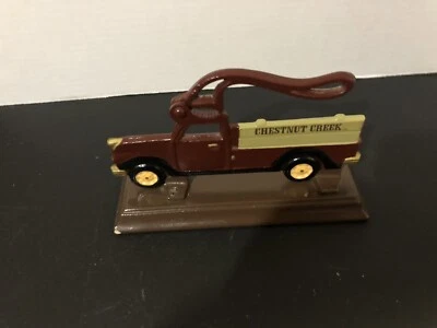 Metal nutcracker Chestnut Creek Farm truck cast iron on stand - Image 1 of 4