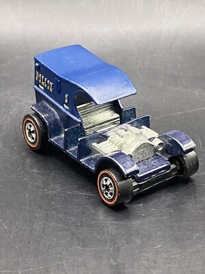 Coche de juguete Hot Wheels Redline Paddy Wagon 1976 Flying Colors de colección base negra Foto 1 de 4