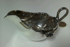A Victorian sterling silver leaf moulded cream jug by James Dixon Sheffield.