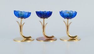 Gunnar Ander for Ystad Metall. Three candlesticks in brass and blue art glass
