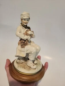 Artista Bruno Merli Statuina Ragazzo Seduto con Bastoncini di Legno Capodimonte Italia - Foto 1 di 12