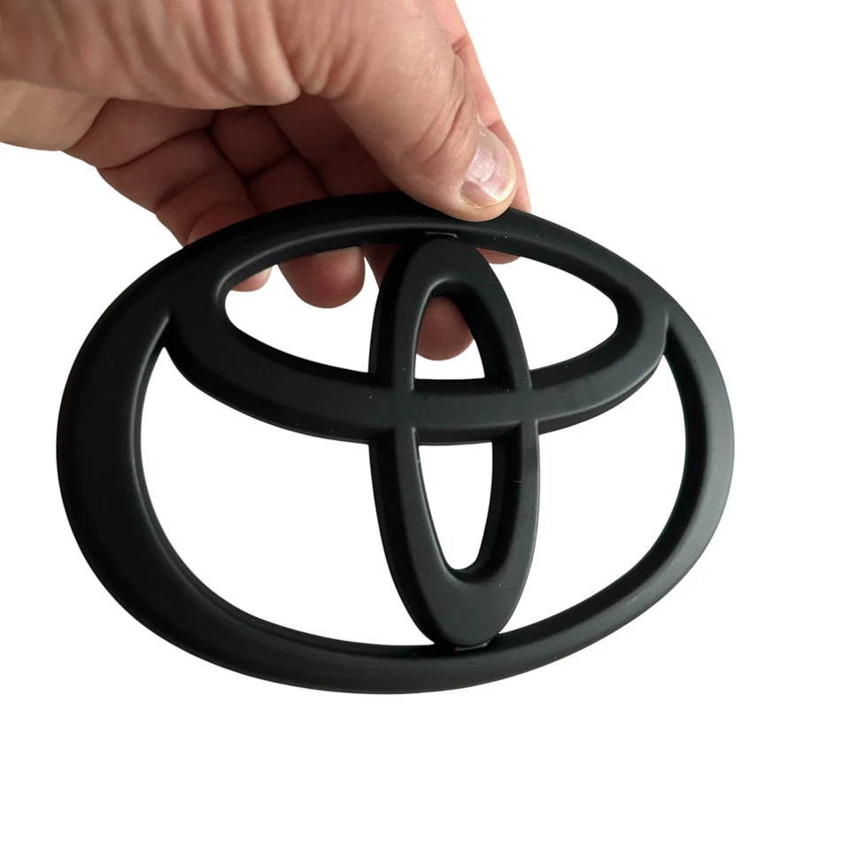 Parrilla delantera Toyota emblema logotipo negro Tacoma 2011 2012 2013 2014 2015 Foto 1 de 4