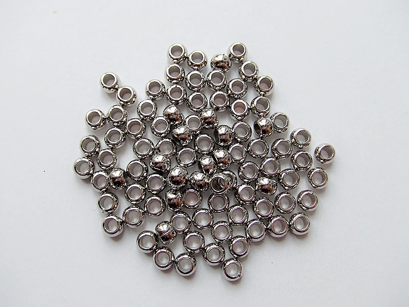 100pz  perline in acrilico 7x5mm tondo colore argento scuro bijoux - Immagine 1 di 1