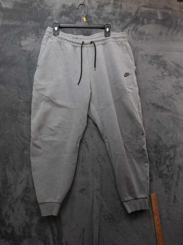 Pantalones de chándal Nike para hombre 2XL gris tecnología polar con puños cónicos Foto 1 de 4