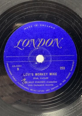 Comedian George Formby Levi's Monkey Mike  sitting on the ice in the ice rink UK - Image 1 of 4