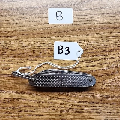 Cuchillo de campamento militar Camillus 1991 EE. UU. de colección Ejército de EE. UU. Marina 4 hojas E104 Foto 1 de 4