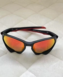 New Oakley Plazma Sunglasses Matte Black Red Frame Prizm Orange Lenses 9019-1159 - Bild 1 von 6