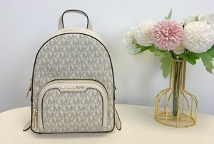 Michael Kors Jaycee Extra Small Zip Pocket Backpack Bag Light Cream MK Signature - Picture 1 of 9