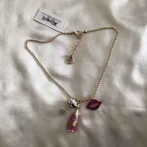 Betsey Johnson Gold Tone Going All Out Charm Necklace Champagne & Lips NWT - Picture 1 of 12