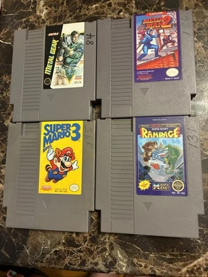 Лот из 4 видеоигр NES, Rampage, Super Mario 3, Megaman 2, Metal Gear протестирован - Изображение 1 из 4