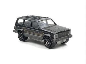 Majorette Jeep Cherokee Limited SUV Black without Surfboards 1:60 France #224 - Picture 1 of 8