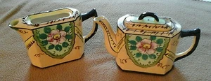 PAIR OF YELLOW W/ BLACK TRIM and PINK FLOWER SMALL TEAPOTS  - Picture 1 of 1